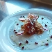 -Cips di polenta integrale con crema di radicchio e noci, servite con bacon, salsa al pecorino e chicchi di melograno - -