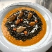 -Fregola al nero di seppia, mantecata con crema di zucca e cozze - -