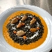 -Fregola al nero di seppia, mantecata con crema di zucca e cozze - -