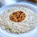 -Risotto con crema di gorgonzola, salmone e lime servito con bottarga e melograno - -