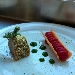 -Trancio di maiale con crosta aromatizzata alle erbe, mezzo cannolo con torcione di purea alla rapa rossa e gel agli asparagi - -