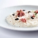 Carnaroli con crema di Pecorino Romano DOP, aglio bruciato, tartare di fassona e jus di vitella - -