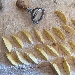 Gnocchi di patate farciti al pecorino, fave e guanciale, cipolla rossa salsa all'uovo arancia e tartufo nero - -