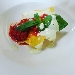 Raviolo aperto al fior di ricotta di bufala e fiordilatte di Agerola con pomodorini di Corbara basilico e coulis di caciocavallo podolico - -